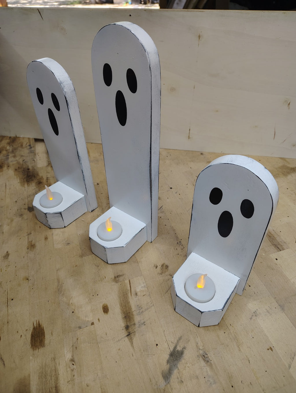 Three rustic wooden Halloween ghost candle holders